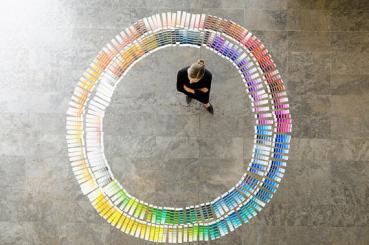 Businesswoman examining paint swatches