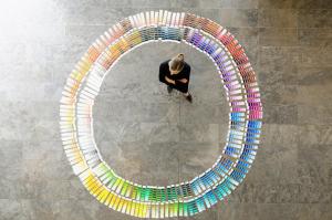 Businesswoman examining paint swatches